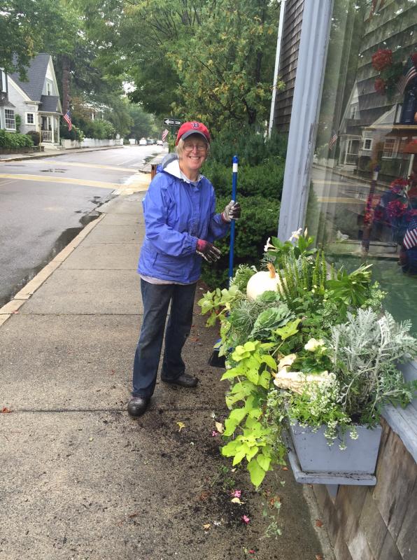 Members work in teams to plant and maintain the town’s window boxes and planters. Shown here is Lindy Williamson at work outside the General Store. COURTESY MARION GARDEN GROUP